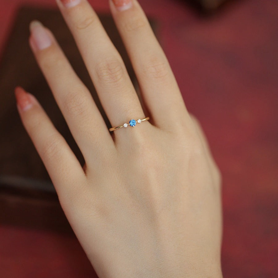 Delicate Blue Constellation Zircon Ring worn on finger with minimalist luxury styling