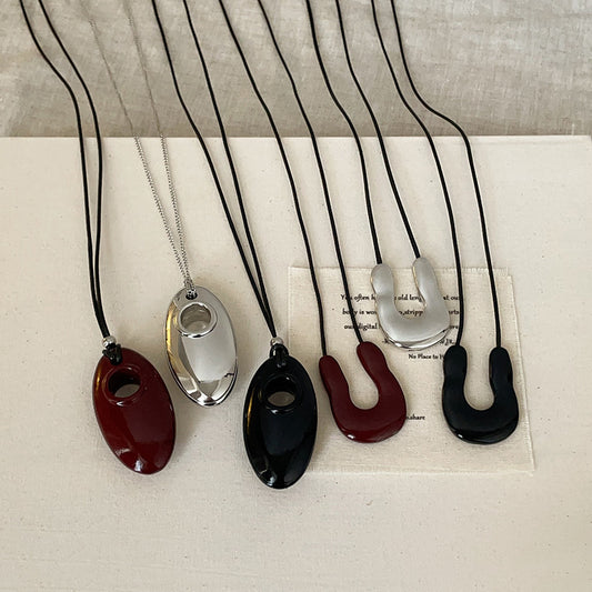 Black cord necklace collection with U shape and oval pendant designs minimalist fashion statement brass jewelry wholesale