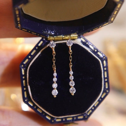 Elegant gold cubic zirconia chain drop dangle earrings in vintage jewelry box, 925 sterling silver earrings wholesale for boutiques.