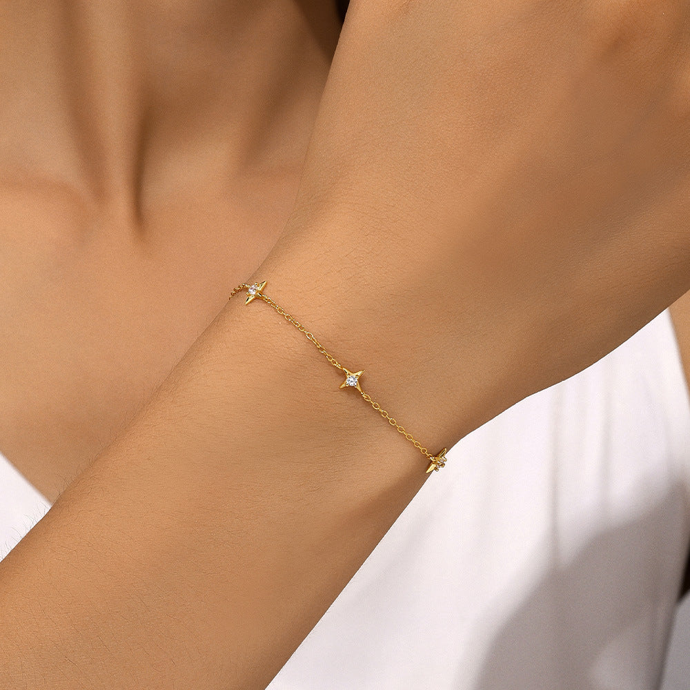 Dainty gold star station bracelet with zircon centers for wholesale jewelry buyers.