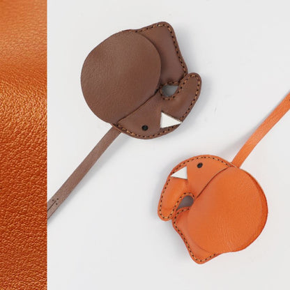 Cute elephant keychain handmade genuine leather charm in orange and brown for handbags and car rearview mirror.