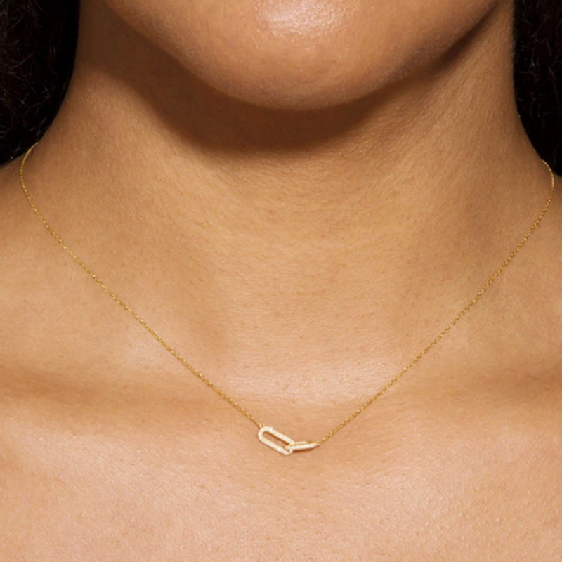 Minimalist S925 sterling silver crossed loop necklace for wholesale jewelry buyers.
