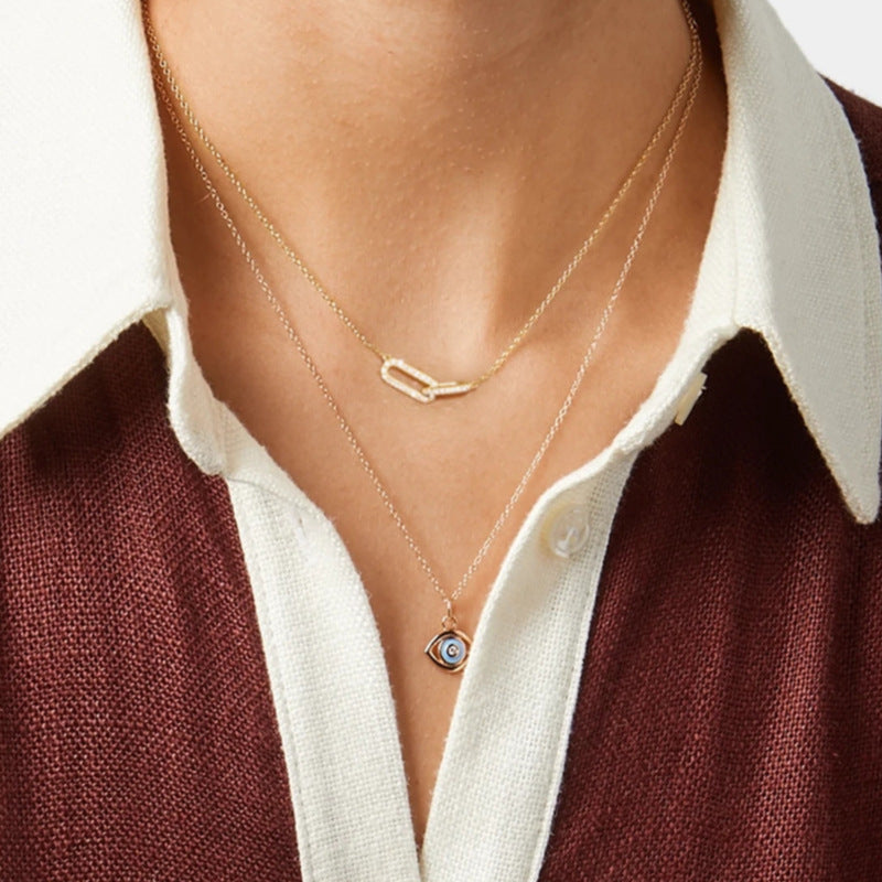 Minimalist S925 sterling silver crossed loop necklace for wholesale jewelry buyers.
