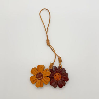 Brown and maroon leather flower bag charms, handmade keychains for creative gift idea and cute bag accessories wholesale.