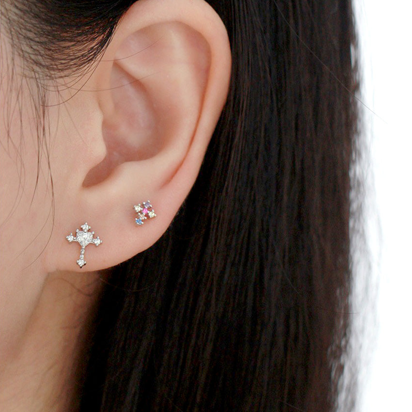 Rotating view of S925 sterling silver screw back cross stud earrings with multicolor cubic zirconia detailing for wholesale jewelry buyers