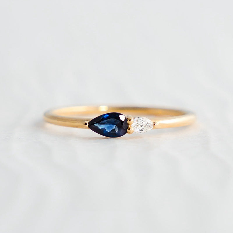 Elegant S925 sterling silver ring featuring blue zircon gemstone and minimalist dual stone design