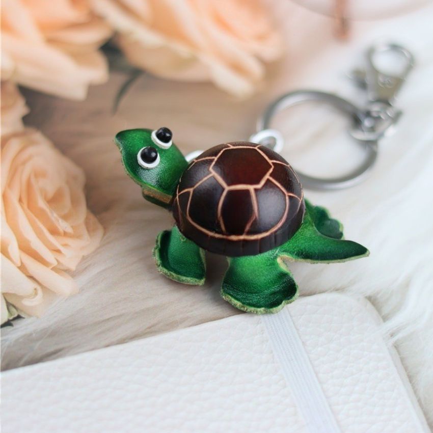 Brown shell mini turtle leather keychain with cartoon eyes