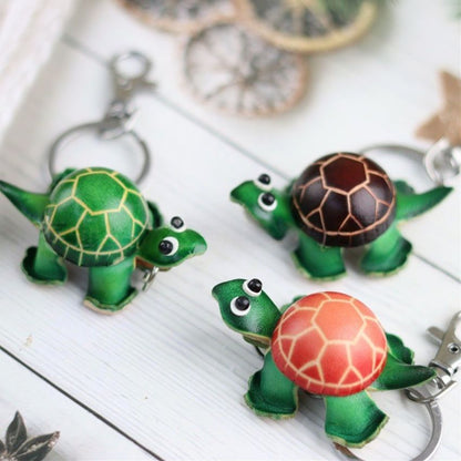 Set of mini turtle leather keychains in green brown and orange shells