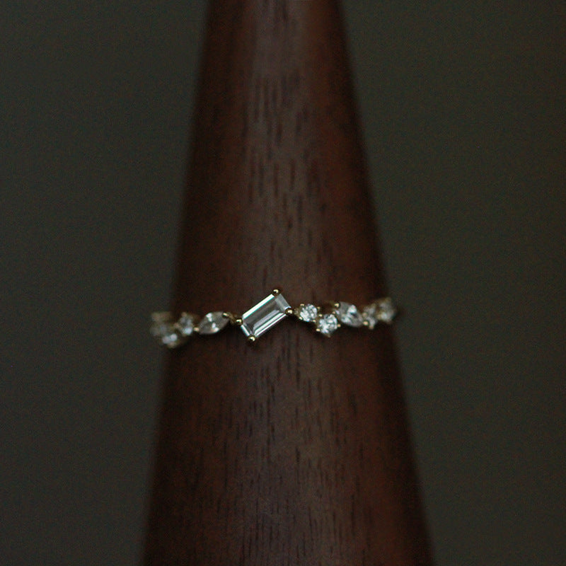 S925 sterling silver Nova Stardust Emerald Ring featuring emerald cut zircon and sparkling accent stones