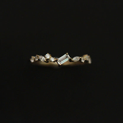 Delicate emerald cut zircon ring worn on finger showcasing minimalist luxury styling