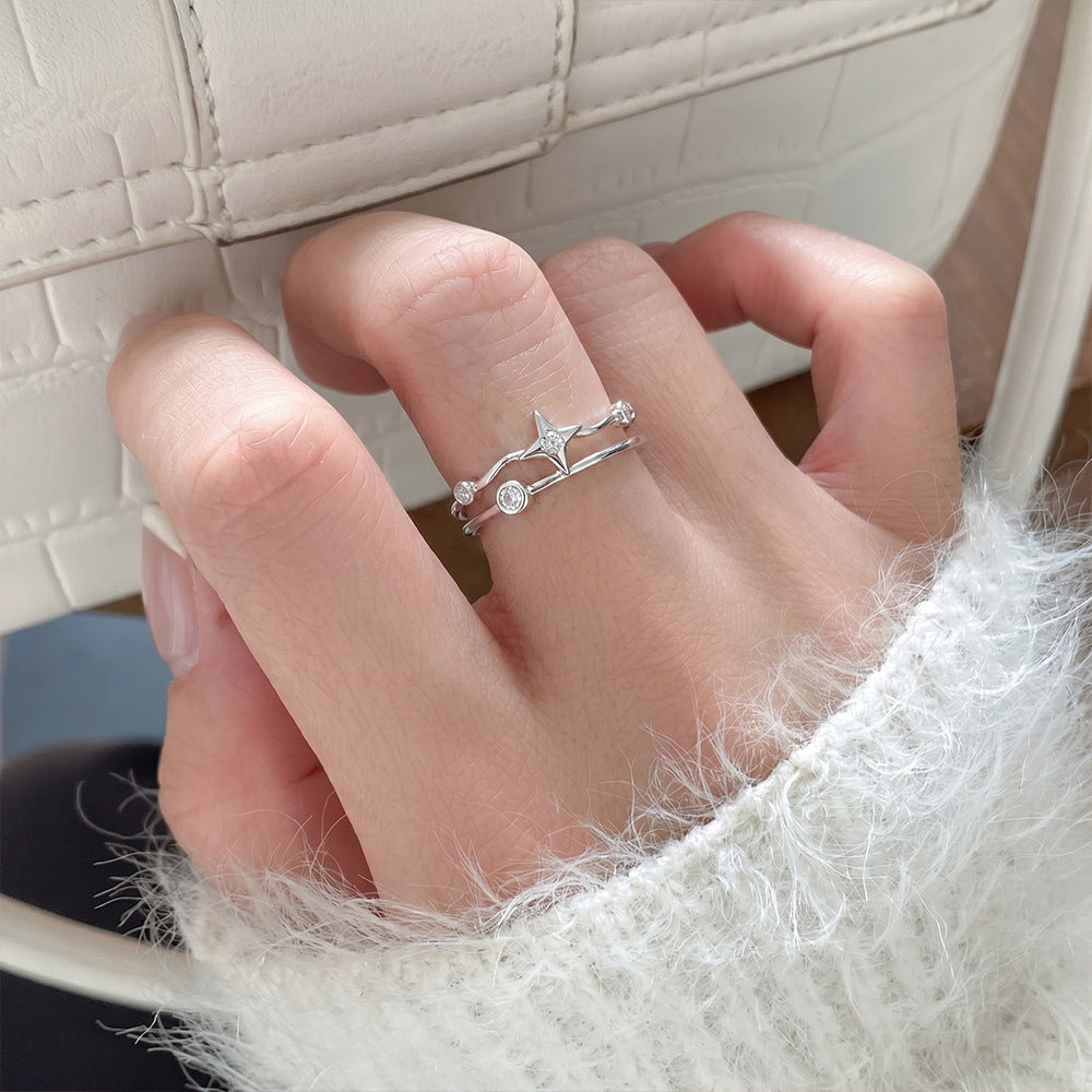Adjustable celestial stacking ring crafted from sterling silver with star motif