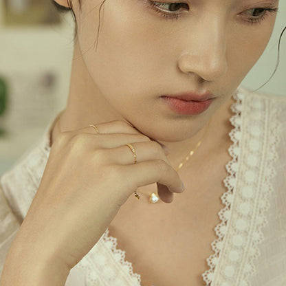 Woman wearing S925 sterling silver adjustable zircon bar ring with 14K gold plating
