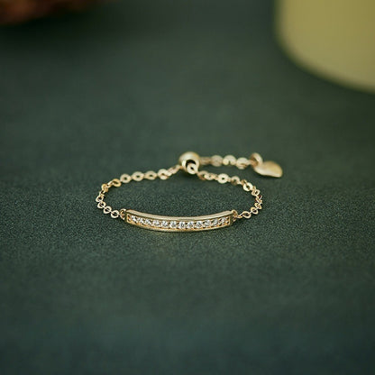 Gold plated sterling silver adjustable ring with sparkling pavé zircon bar