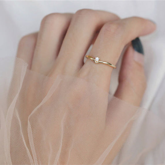 Woman wearing S925 sterling silver quiet luxury solitaire ring with zircon stone