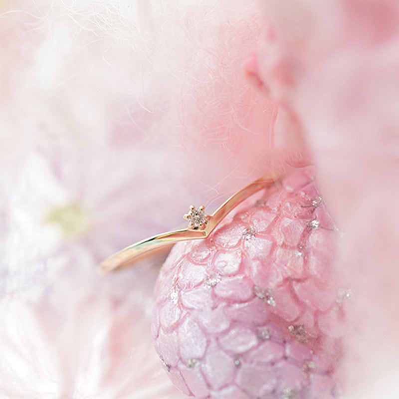 Close up of S925 sterling silver solitaire ring with sparkling zircon centerpiece