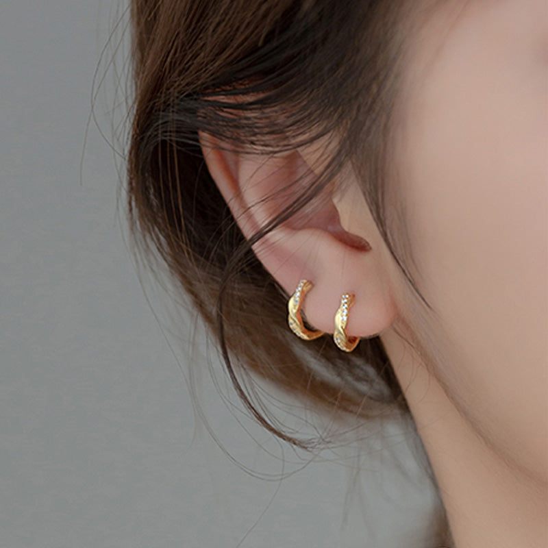 a woman wearing gold 925 Sterling Silver Curved Crystal Earrings