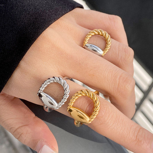 Adjustable stainless steel ring in twisted oval shape, affordable wholesale jewelry gift option.