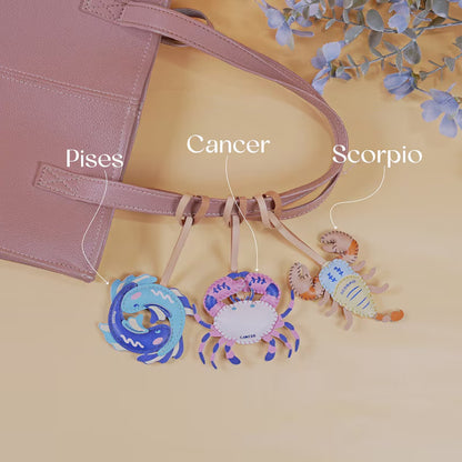 Zodiac bag charm wholesale Aries Leo and Sagittarius collection handmade leather keychain charms for handbags and boutique gift exchange ideas