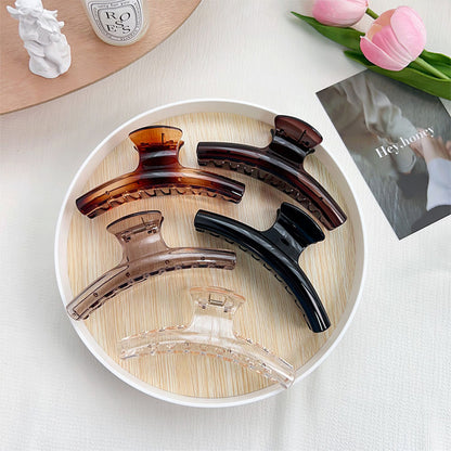 arc line shape hair claw clip  in brown black translucent color