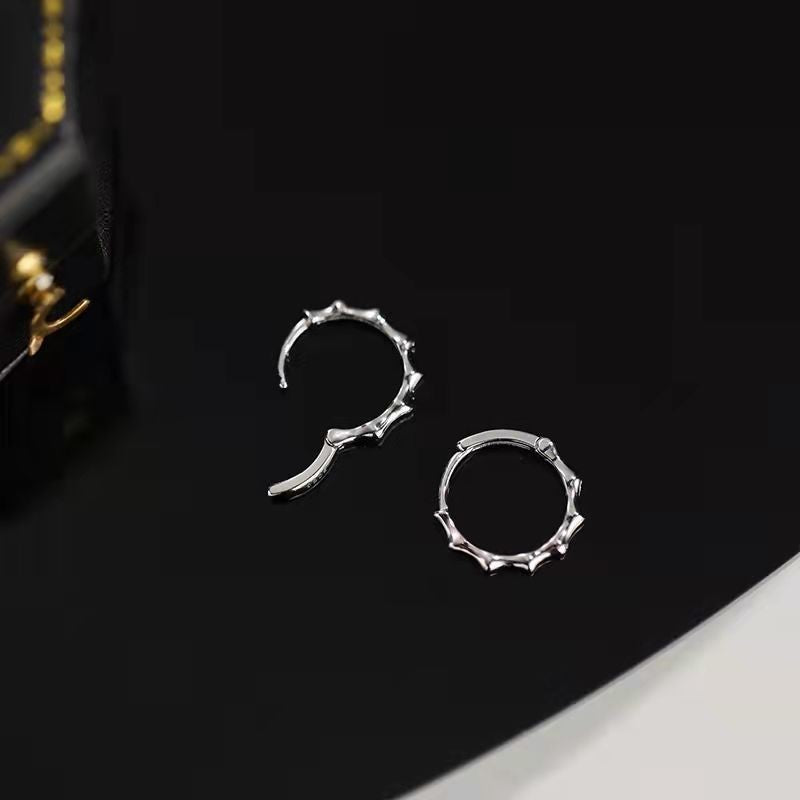 Polished S925 silver bamboo texture hoop earrings with secure huggie closure