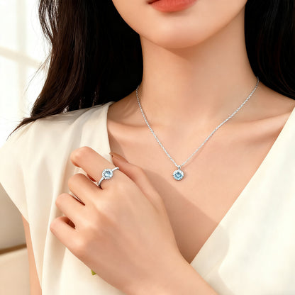 Model wearing 925 sterling silver blue zircon necklace and matching ring with floral design