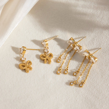 Assorted gold bow tassel earrings with teardrop zircon stones for wholesale display