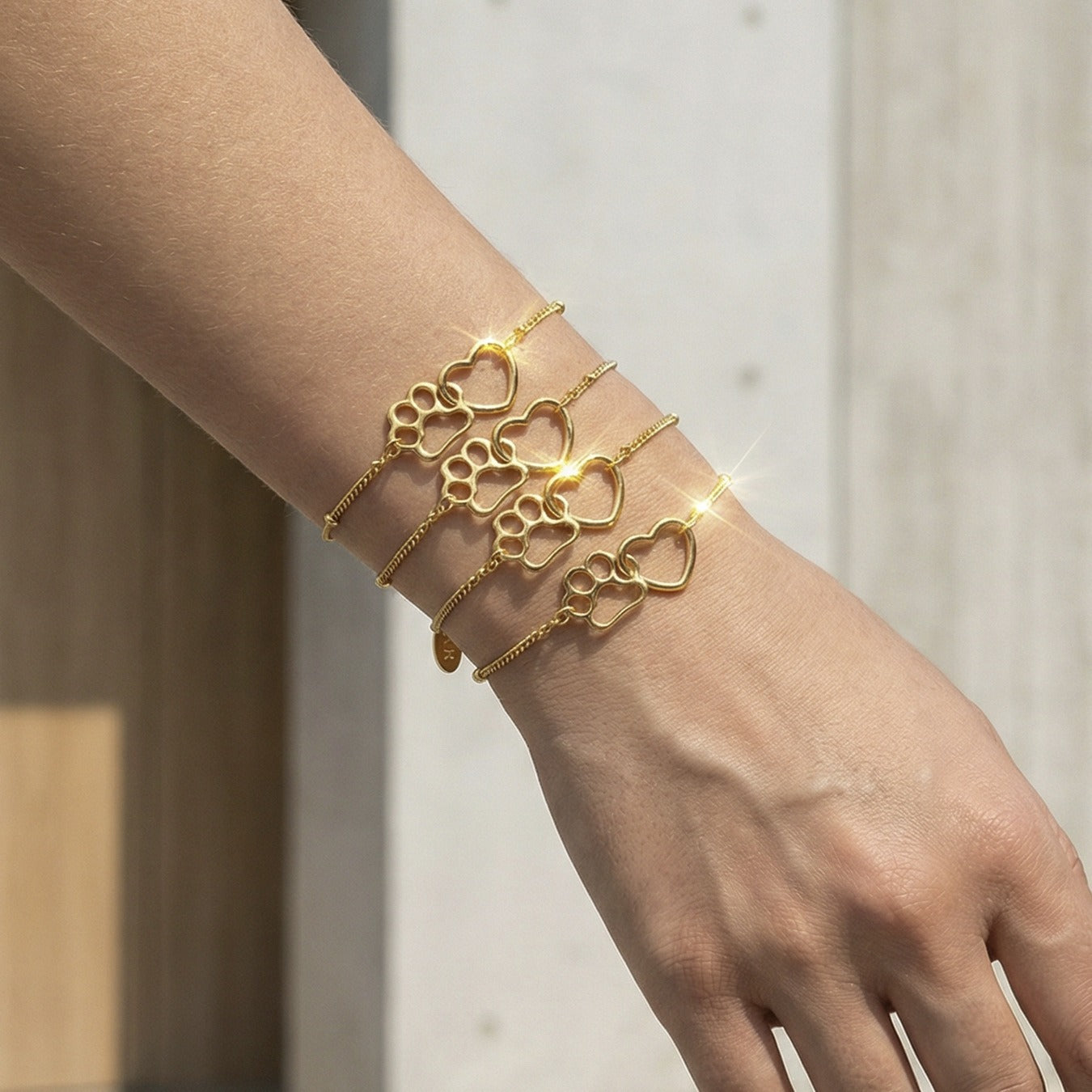 Gold tone cat paw bracelet on wrist stainless steel adjustable chain