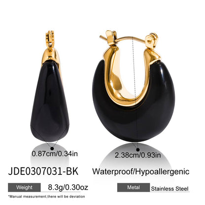 Jet black resin hoop earrings with gold tone stainless steel hinged closures