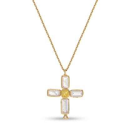 Gold tone cross pendant necklace with baguette style stones and center accent on white background