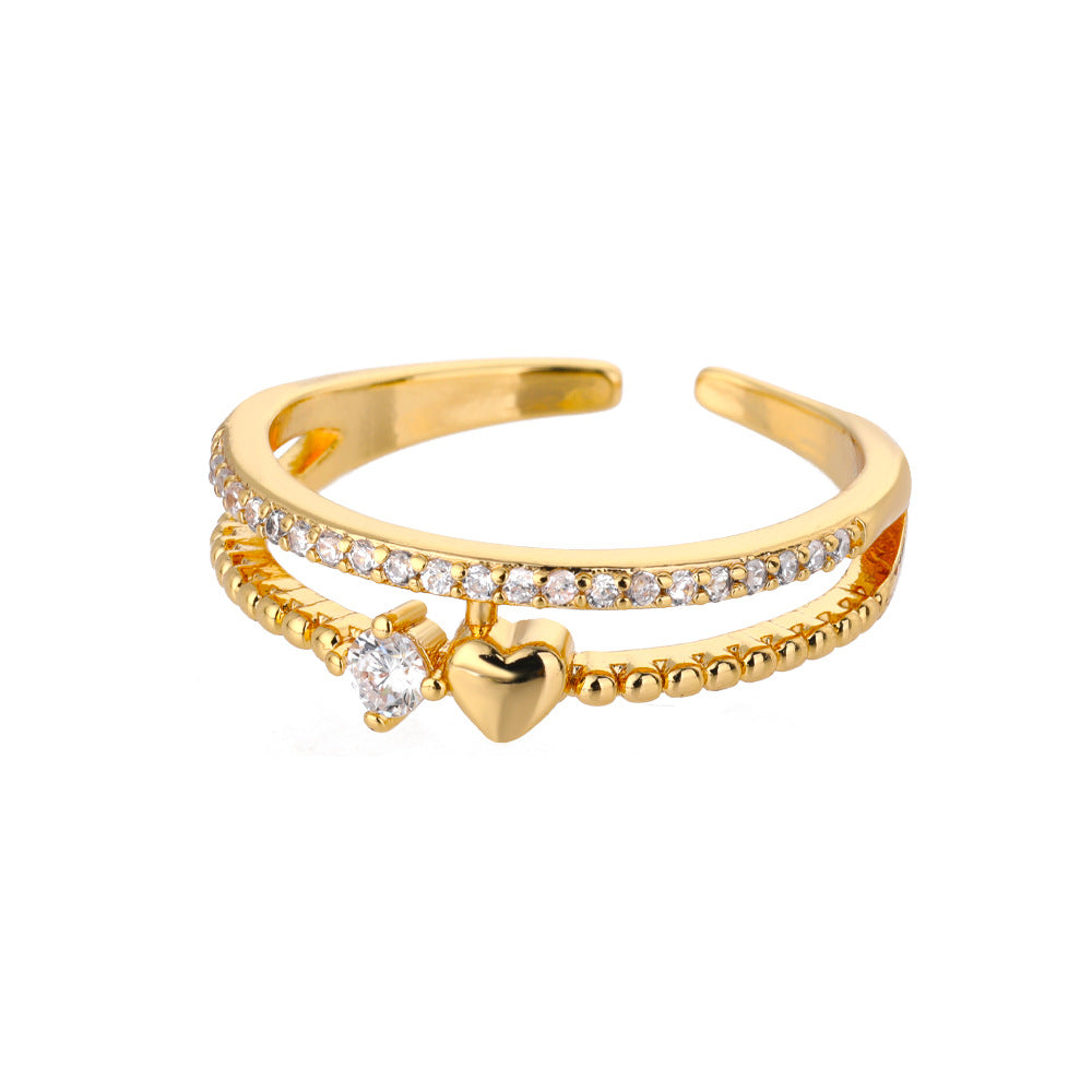 Gold tone open ring with heart charm and cubic zirconia detail for boutique wholesale jewelry