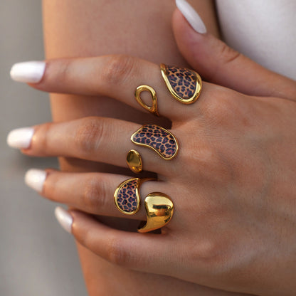 Gold tone stainless steel geometric leopard rings worn in multiple adjustable styles