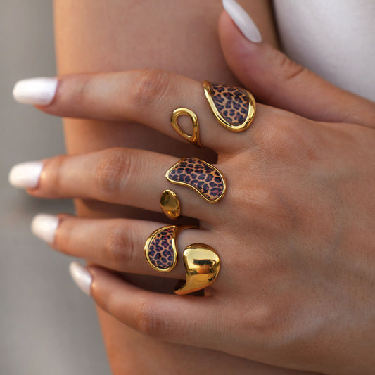 Gold tone stainless steel geometric leopard rings worn in multiple adjustable styles