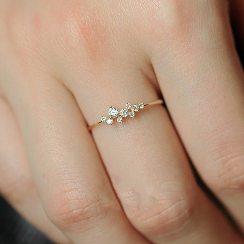 S925 sterling silver 14K gold plated zircon star ring worn on finger with delicate asymmetrical design