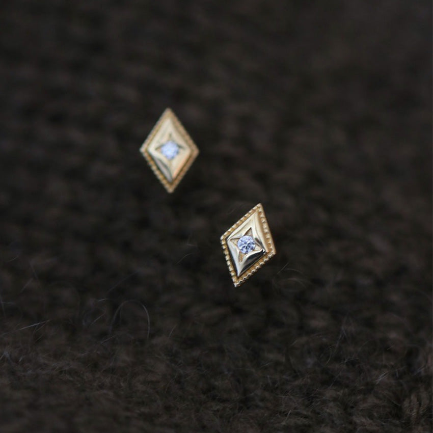 18K gold diamond shaped stud earrings close-up