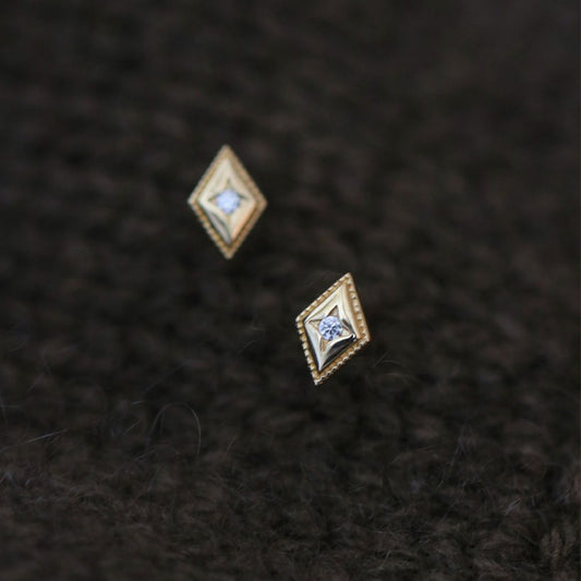 18K gold diamond shaped stud earrings close-up