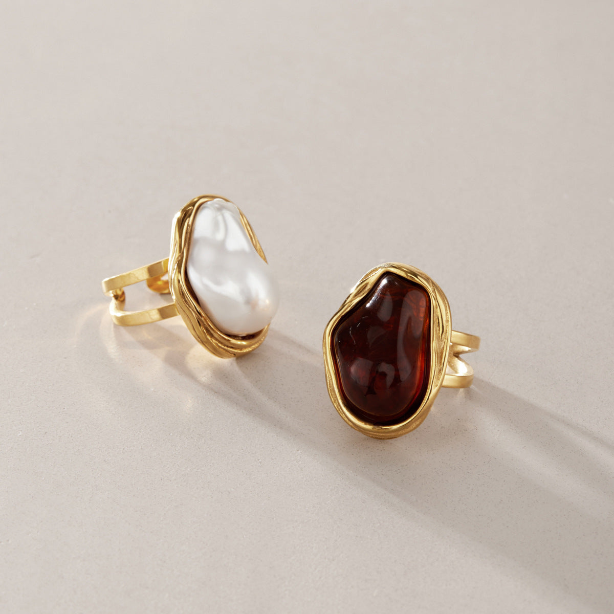 Adjustable stainless steel statement ring with faux baroque pearl or brown accent