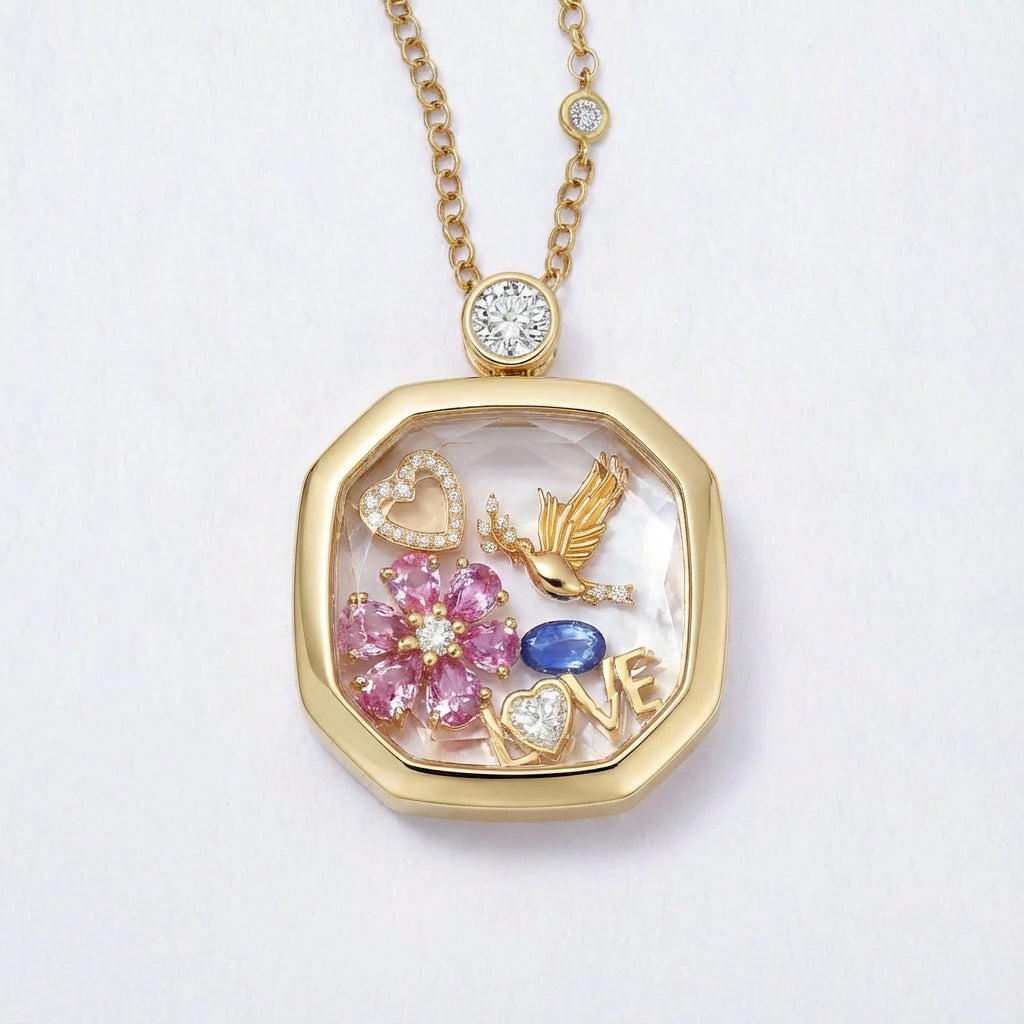 Close up of square glass memory locket pendant with floral heart and bird details on box chain necklace