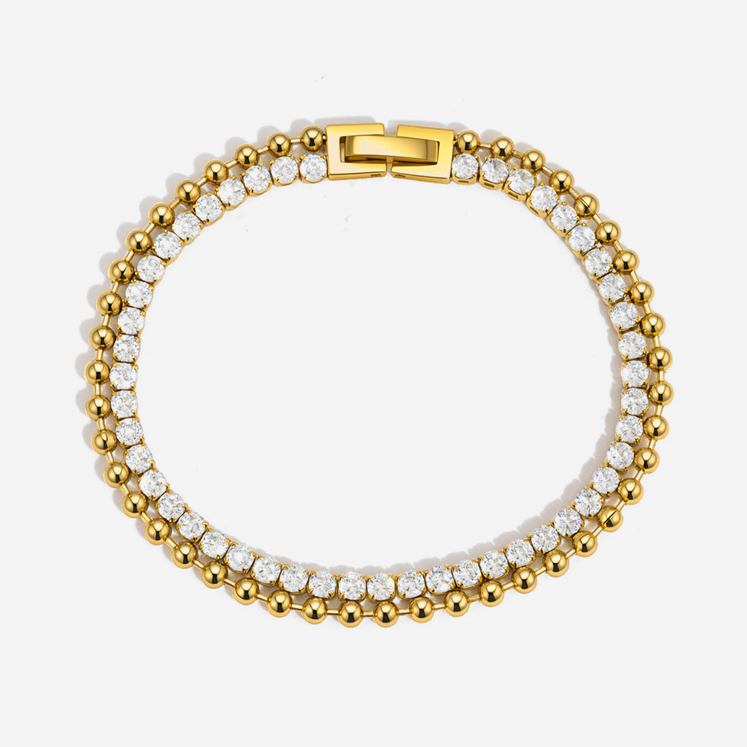 Gold double row bracelet with clear cubic zirconia tennis row and polished beaded row