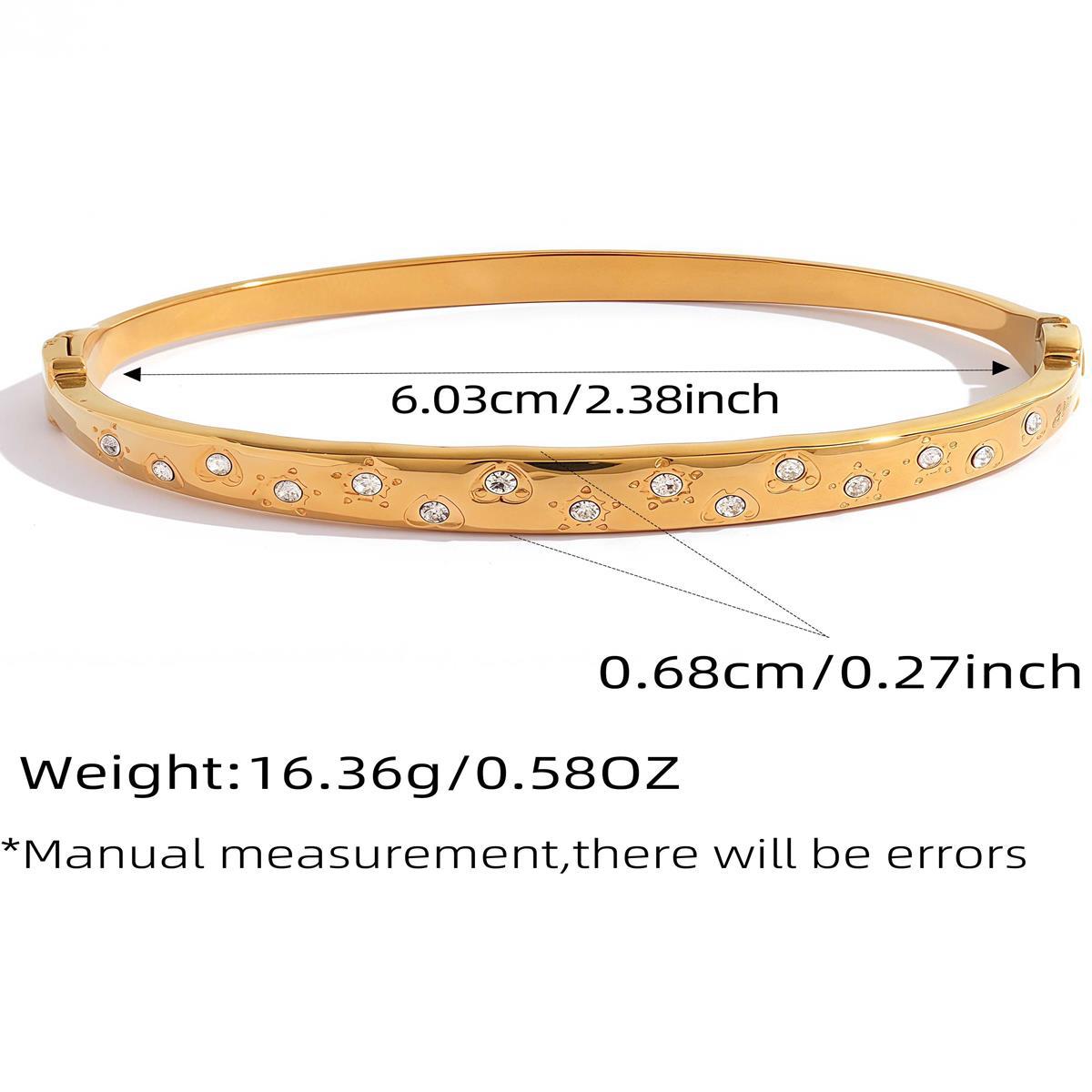 Gold scattered cubic zirconia bangle with 6.03 cm inner diameter and polished finish
