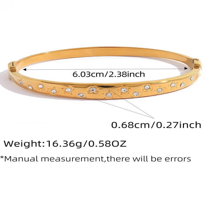 Gold scattered cubic zirconia bangle with 6.03 cm inner diameter and polished finish