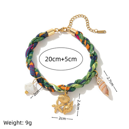 Green braided ocean bracelet size reference with starfish shell and conch charms