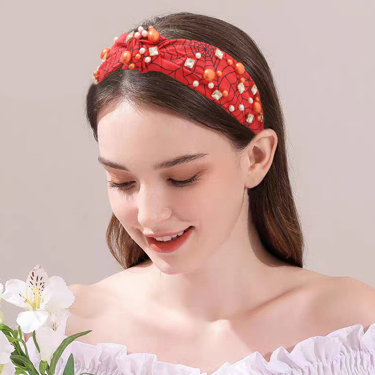 a woman wearing a red halloween hairband