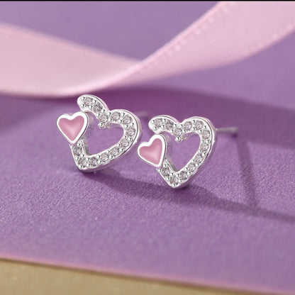 Detail shot of S999 silver pink heart enamel earrings for wholesale jewelry buyers
