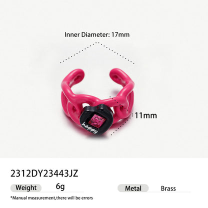 Hot pink flame shaped brass ring with black heart and pink crystal.