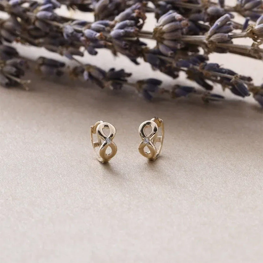 S925 sterling silver infinity earrings with 18K gold plated finish and cubic zirconia accents