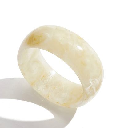  Cream color irregular wide resin bangle with marbled texture
