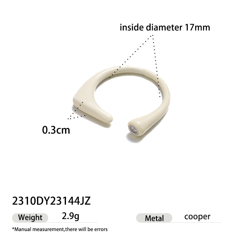 Ivory enamel open ring featuring a subtle zircon stone and modern silhouette