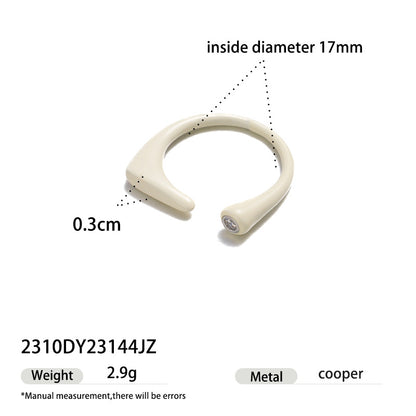 Ivory enamel open ring featuring a subtle zircon stone and modern silhouette