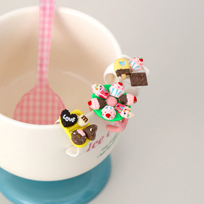 Five piece kawaii dessert ring collection featuring cake candy and ice cream designs