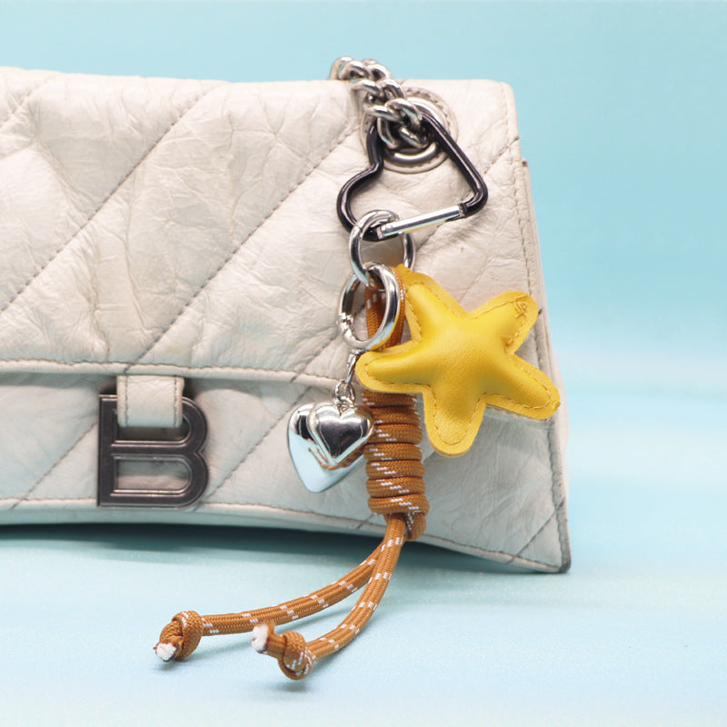 Yellow star PU leather keychain with silver heart charm and rope strap for bulk sale